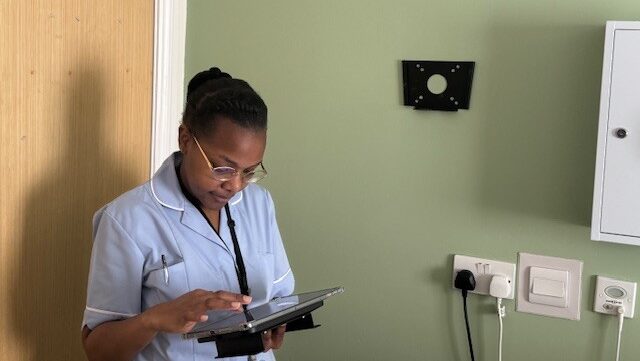 Twinglobes carer using tablet